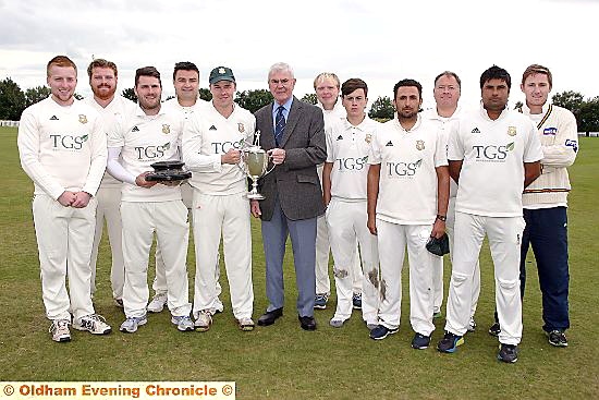 TITLE TRIUMPH: Saddleworth captain Brian Lord receives the Hollingworth Challenge Trophy from Eddie Bayliss, chairman of the SWB Commercials Saddleworth and District Cricket League. TITLE TRIUMPH: Saddleworth captain Brian Lord receives the Hollingworth Challenge Trophy from Eddie Bayliss, chairman of the SWB Commercials Saddleworth and District Cricket League.