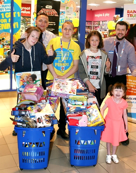 THUMBS-UP: (from left) Alisha-Paige Harrison, store manager Colin Waters, sales assistant Gary Buckley, Carmen-Amy Harrison, manager Gary Rumens and Takoda-Tracey Wright
