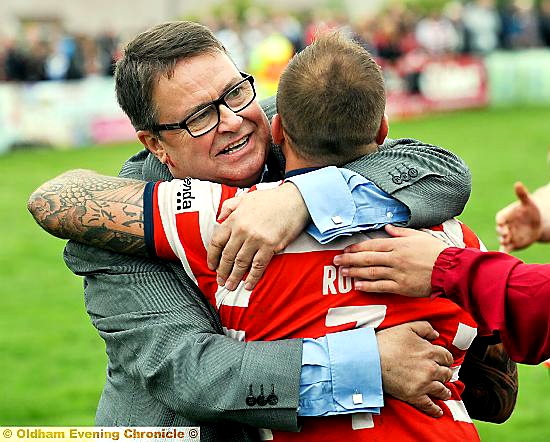 Oldham chairman embraces Steve Roper at the final hooter.