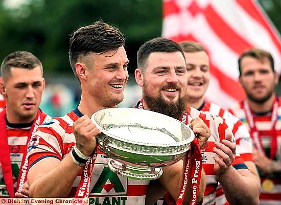 IT’S ours: Oldham captain Lewis Palfrey shows off the Kingstone Press League One championship trophy