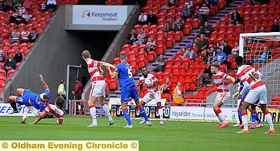 WOUNDED WARRIOR . . . Jonathan Burn (his head bandaged) puts his body on the line to grab Athletic’s equaliser.