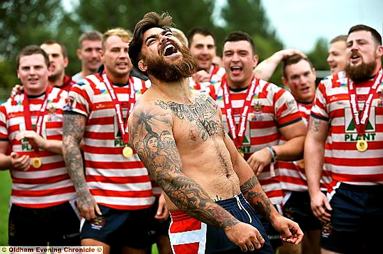 THE LAST LAUGH: watched by his Oldham team-mates, Sam Gee leads the after-match celebrations.