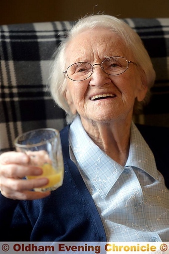 Gladys Wild celebrates with a glass of orange Gladys Wild celebrates with a glass of orange