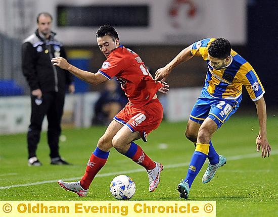 GETTING SHIRTY . . . lone striker Rhys Turner is tugged back by an uncompromising Shrewsbury defender.