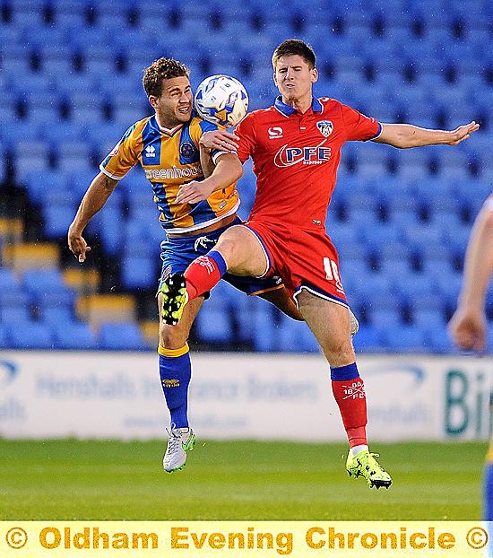 BEST OF ENEMIES . . . former team-mates James Wesolowski and current Athletic player Danny Philliskirk battle for possession.