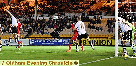 GOAL: Big centre forward Michael Higdon put his team in front after 35 minutes. 