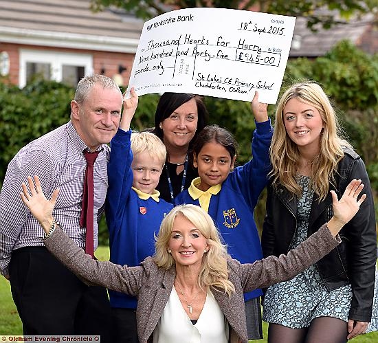 Harry’s mum Debbie (front) with (from the left) St Luke’s head teacher Ian Walsh, head boy Charlie White, healthy schools co-ordinator Ann Trickett, head girl Lilia Mercado and Harry’s sister Emily