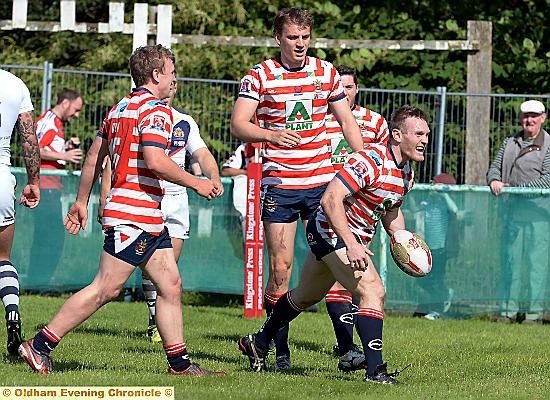 TRY DELIGHT: Oldham full-back Richard Lepori celebrates with Gareth Owen (left) and Jon Ford (centre) after crossing for the opening score. PICTURES by TIM BRADLEY
