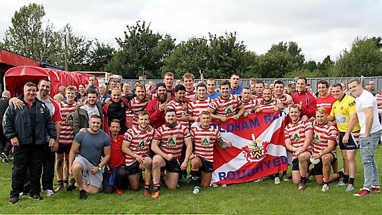 TEAM SPIRIT: Oldham players and staff line up following their last regular-season home game.
