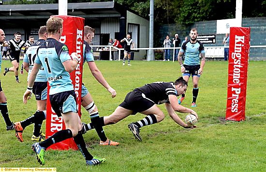 Gareth Morgan dives in for Saddleworth Rangers. PICTURES by TIM BRADLEY
