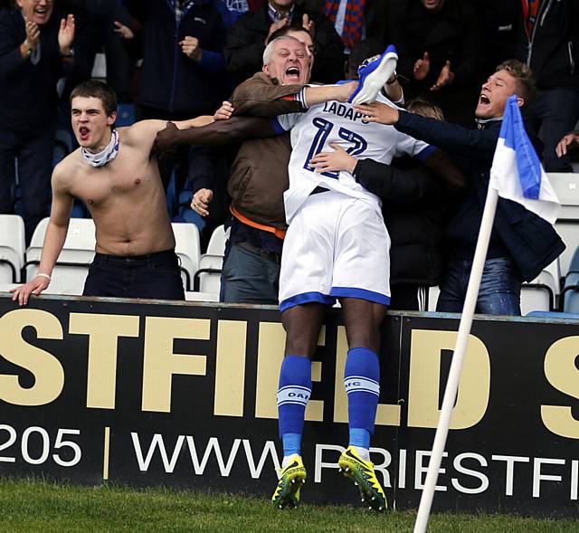 YOU'RE THE MAN . . . Freddie Ladapo is mobbed by fans after equalising for Athletic
