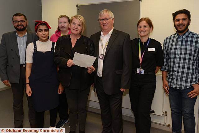 WE all stand together . . . (from left) Fazal Rahim, Ayra Ali, Anne-Marie Jones, Sylvia Lancaster, Mike Doran, Inspector Gayle Brister and Usmaan Mahmood
