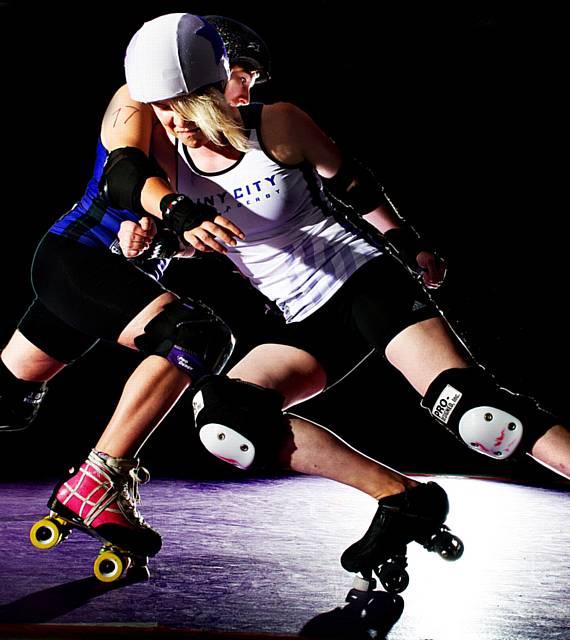 Rainy City Roller Derby players in action Liz Yeatman takes on Alex Wilde.