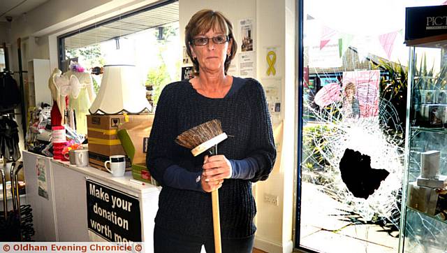 DR Kershaw's charity shop volunteer Alison Taylor clears up