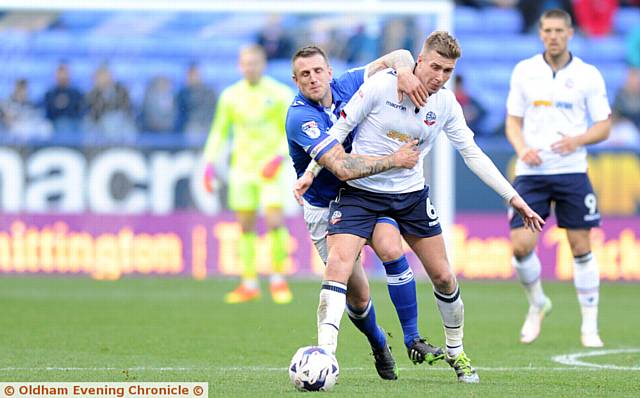 STRONG IN DEFENCE . . . Athletic skipper Peter Clarke shows his mettle against Bolton. PICTURE by ALAN HOWARTH