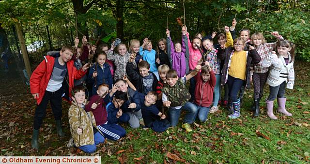 PUPILS at Diggle Primary School who have been involved in building dens in the school grounds. 
