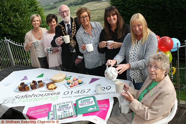 Safehouses Fostering, Denshaw,, Oldham, held a MacMillan coffee morning. Pic shows, Joanne Doherty, social worker,Tracy Gregory, Foster Carer, Mayor of Oldham, Derek Heffernan, Diane Flitcroft, Foster Carer, Adrienne McDonald, Foster Carer, Janet Chatterley, Foster Carer, Mayoress of Oldham, Di Heffernan.
