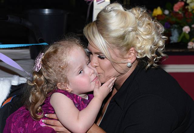 GIVE us a kiss . . . Millie Moran and mum Emma Clarke 