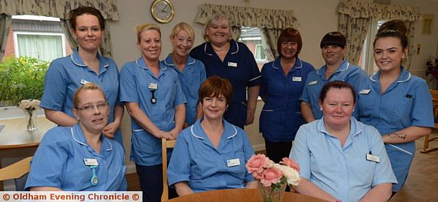 PRIDE in Oldham nominees, staff at the Miller House unit at Shawside Nursing Home. Back, from left, Elizabeth Taylor, Jane Buckley, Bridget Armstrong (care assistants), Dianne Oliver (house manager), Annette Gilbert (registered nurse), Sarah Butterworth, Jenna McDonald (care assistants). Front, from left, Anita Warrington, Pearl Davenport (care assistants), Amanda Hart (housekeeper)