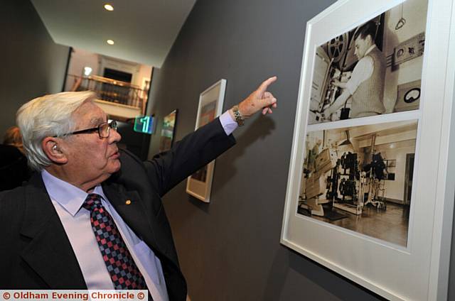 THAT'S me . . . George points to his picture on the wall at the Odeon