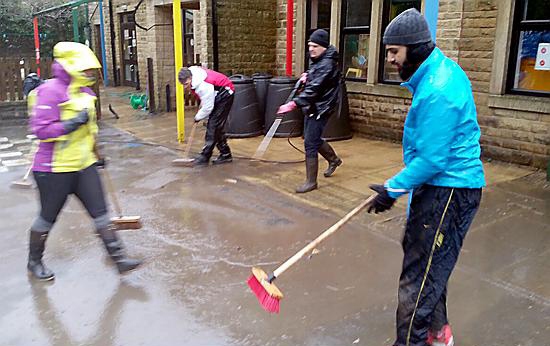 Volunteers from Oldham help clear out some of the homes badly hit by the floods Volunteers from Oldham help clear out some of the homes badly hit by the floods