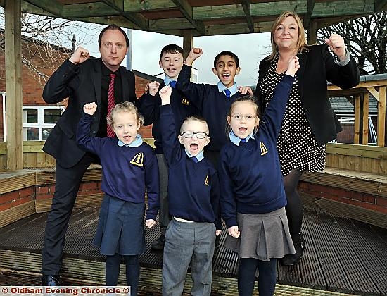 TOP class . . . head teacher Chris Hanson and deputy head Helen Williamson with (clockwise from left) Mollyrose Meyer, Joseph Cassell, Haider Mahmood, Martyna Lukaszewska and Matthew Fold
