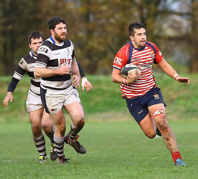 JINKING RUN . . . Josh Watson takes on the Trafford MV line