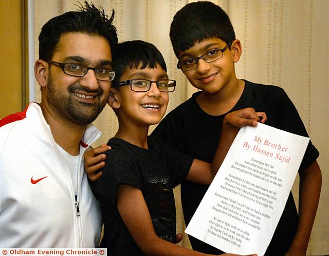 HASSAN Sajid (centre) with his winning poem about his brother Raihaan (right) and proud father Sajid Iqbal