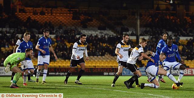 GOALMOUTH SCRAMBLE . . . Peter Clarke tries to turn his man in a congested penalty area