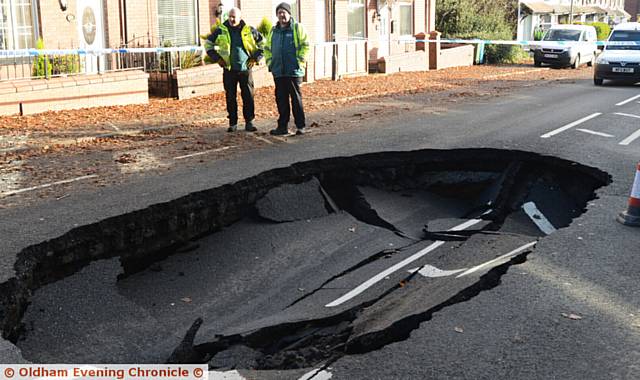 A huge sink hole has appeared in the centre of Rochdale Road, near Tandle Hill Park.