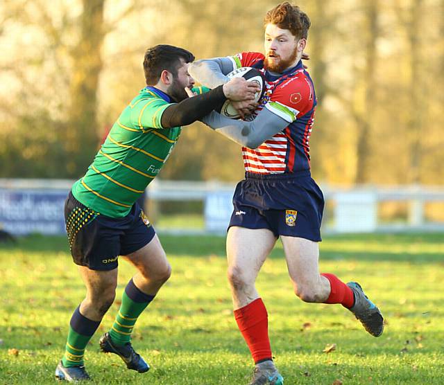 ALEX Jobson tries to fend off a Fleetwood tackle.