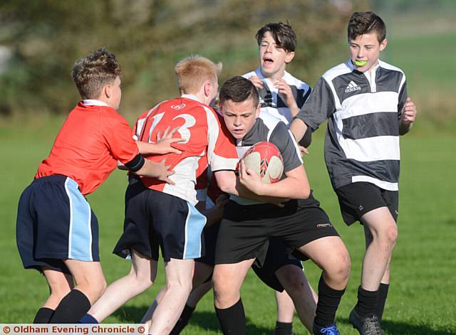 TRYING TO MAKE PROGRESS . . . Charlie Whitfield (Failsworth) has the ball in his possession during a match against Saddleworth