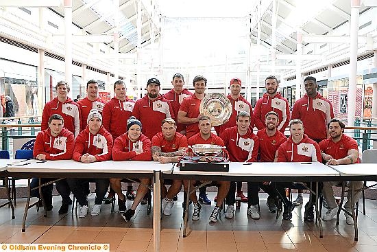 TROPHIES on display . . . the players show off their silverware