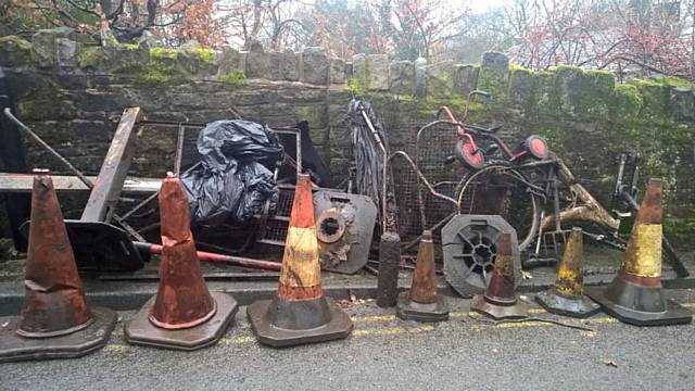 MUD-CLAD bikes, fencing and garden furniture were discovered by the Uppermill clean-up team.