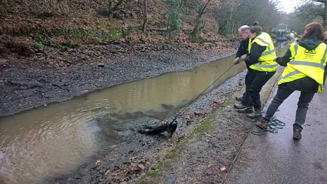 UPPERMILL Community Action Network spent an entire day pulling discarded waste from the waters.