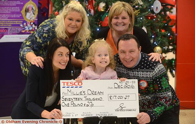 WE did it . . . with Millie are (from left) Maria Toora (manager Tesco, Westwood), mum Emma Clarke, grandmother Victoria Shaw and Andrew Brown (manager Tesco Oldham)