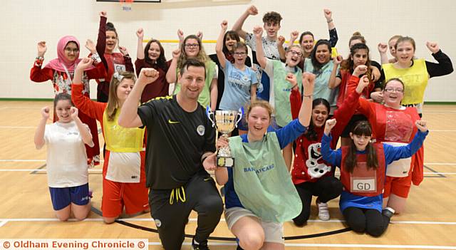 MANCHESTER City disability co-ordinator Paul Kelly (front) with captain Cherrie Gardner and the squad