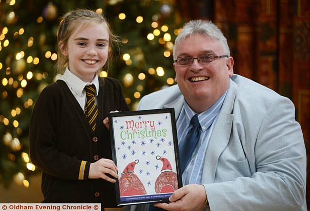 CHRISTMAS card winner . . . Evie Kinghorn with Councillor Sykes