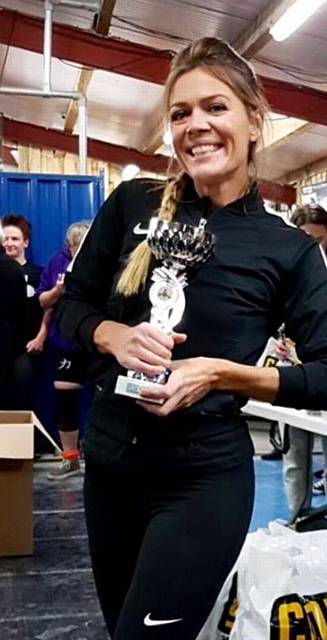 JANE Girdlestone (41) with her trophy after the North-West Powerlifting Championships.