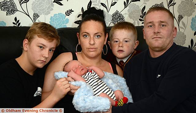 SHOCKED . . . (from left) Lewis Jackson, new baby Noah Jackson, mum Kelly Renton, Baily Jackson and dad Michael Jackson