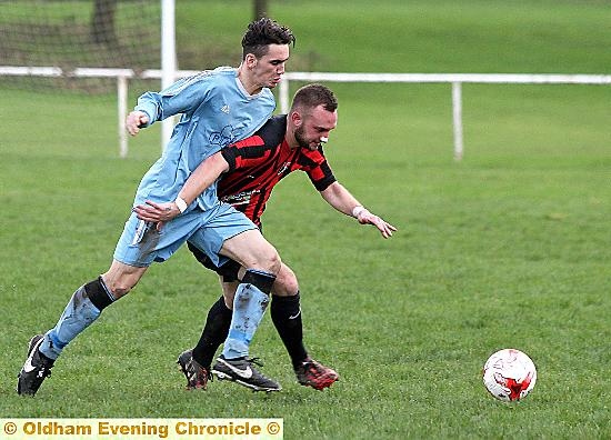 ON THE ATTACK: Springhead’s Matthew Russell, with a plaster on his nose, tries to shrug off a Royton opponent. ON THE ATTACK: Springhead’s Matthew Russell, with a plaster on his nose, tries to shrug off a Royton opponent.