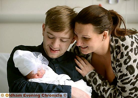 Emelie Beau Heyes with parents Kathryn and Tom Heyes