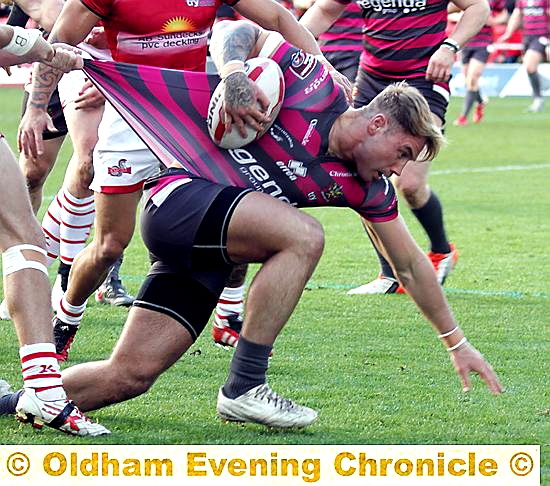 TUGGED BACK: Danny Langtree tries to free himself of a tackle.