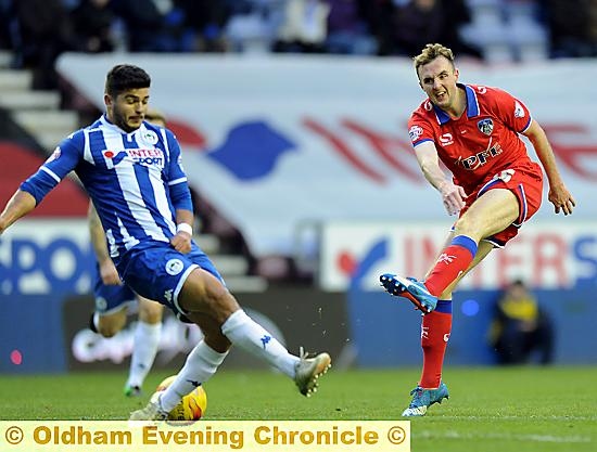 NOT THIS TIME . . . Latics’ Carl Winchester takes a strike at goal.