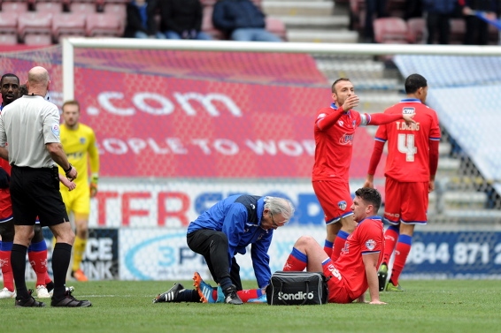 PAINFUL BLOW . . . Anthony Gerrard receives treatment to his knee before leaving the field. PAINFUL BLOW . . . Anthony Gerrard receives treatment to his knee before leaving the field.