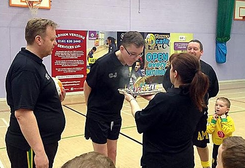 Chris Jones blows out the candles on his cake celebrating his 21st birthday and gaining his coaching award