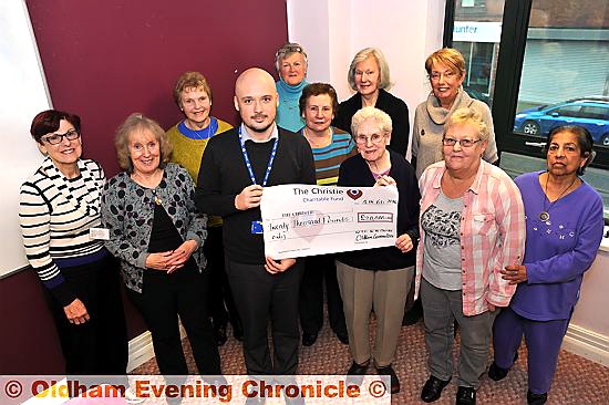 CANCER boost . . . Daniel Poole, The Christie fundraising manager, receives the cheque from Mildred Taylor, the committee’s longest-serving member CANCER boost . . . Daniel Poole, The Christie fundraising manager, receives the cheque from Mildred Taylor, the committee’s longest-serving member