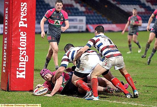 FINISHING TOUCH . . . Michael Ward scores his second and the Roughyeds’ fifth try at Spotland.

