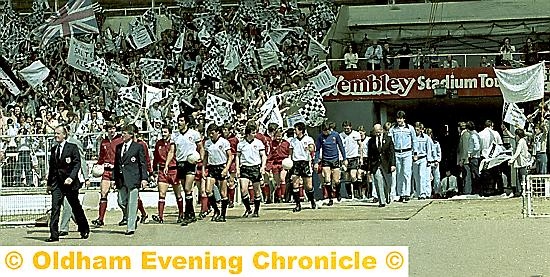 SO PROUD . . . Bob Murphy leads out Mossley at Wembley in 1980.