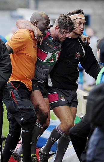 HEARTBREAK . . . for Craig Briscoe, who is helped off at Barrow.